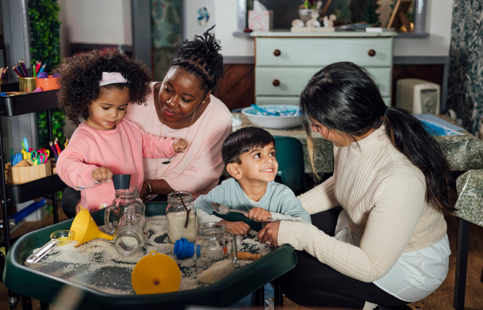 Women playing with children