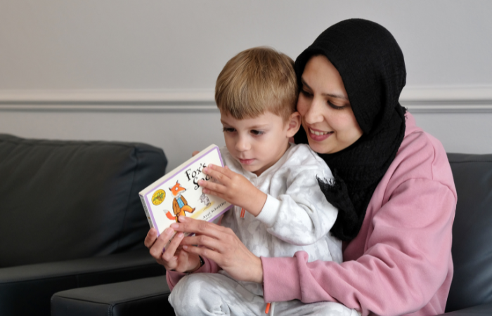 Woman reading with child