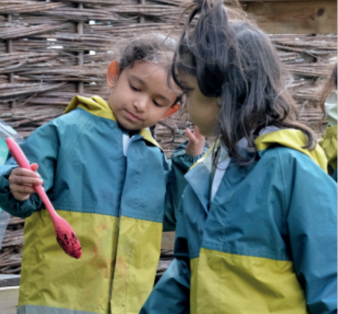 Children playing with a spade